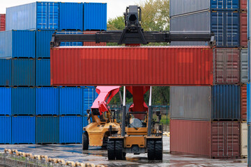 Reach stacker moves intermodal container to railroad platform.