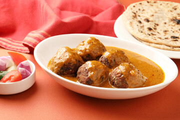Veg Kofta Curry is an exotic Indian gravy dish made from mix vegetable dumplings dunked in a onion-tomato based gravy