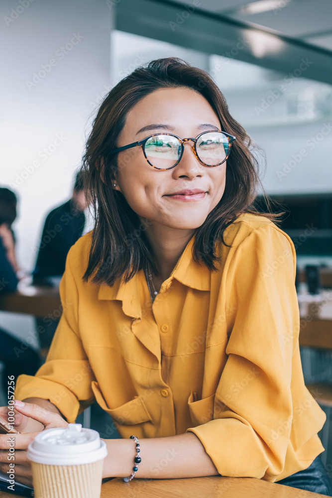 Poster portrait of cheerful hipster girl in optical spectacles for provide eyes protection looking at camer