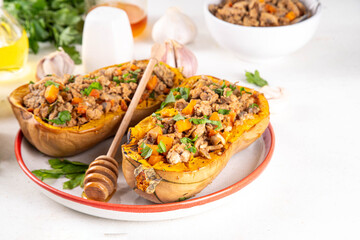 Baked stuffed butternut pumpkin, oven or grill roasted butternut squash with beef and vegetable