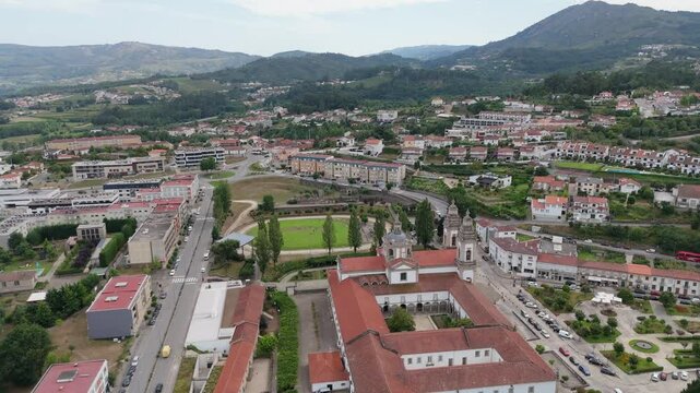 Aerial view of the Monastery of S&atilde;o Miguel de Refojos in Cabeceiras de Basto, Braga, Portugal, surrounded by urban and green landscapes