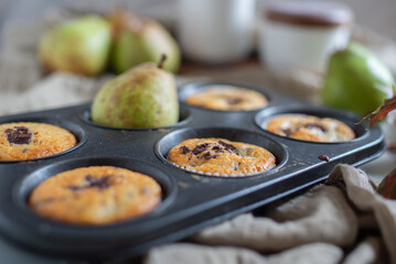 Muffins with chocolate and pears 