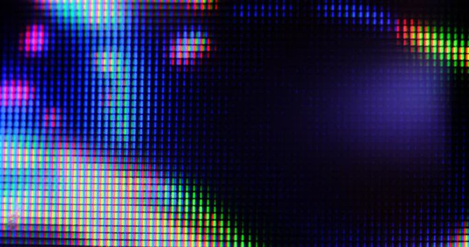 Extreme macro view of 4K LED matrix red, blue, and green sub-pixels, monitor, or TV screen