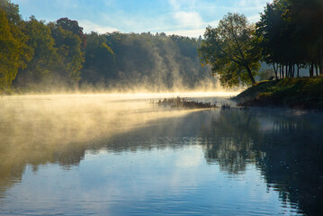 fog over the river on a sunny autumn morning