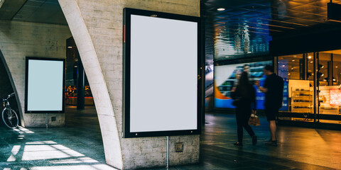 Clear Billboard in public place with blank copy space screen for advertising or promotional poster content, empty mock up Lightbox for information, blank display in station area with daylight