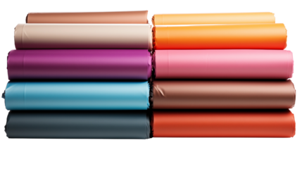 Colorful rolled paper sheets, studio view, isolated on white background.