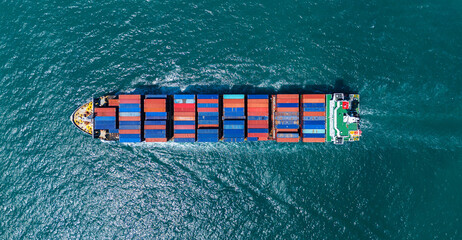 Cargo container ship carrying container and running out international container port customs...
