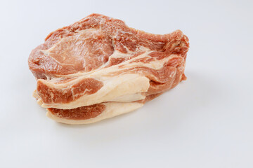 Several steaks of raw pork arranged in row ready for marinating