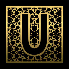 Letter U is carved in vintage patterned square on black background. Golden monogram in vintage style. © PerepadiaY