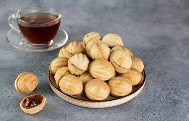 Russian cookies Nuts or Oreshki in shape of a walnut with boiled condensed milk. Russian cuisine, desserts.