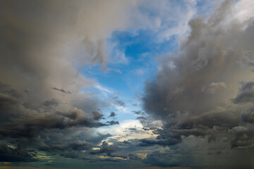 Cumulonimbus clouds forming before thunderstorm on evening sky. Changing stormy cloudscape weather...