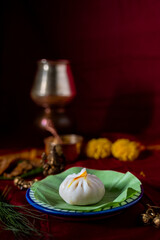 Indian Traditional sweet dumplings made with rice flour dough and a sweet filling of coconut and jaggery also known as Modak