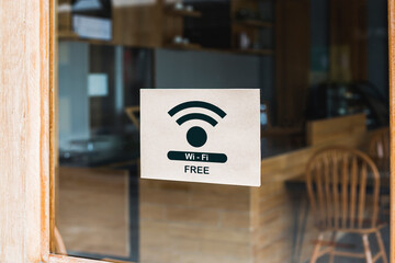 Free Wifi sign at the front entrance of the coffee shop to serve customers