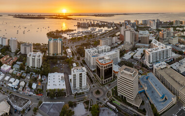 Sarasota, Florida at sunset. Luxury yachts docked in Sarasota Bay marina. American city downtown...