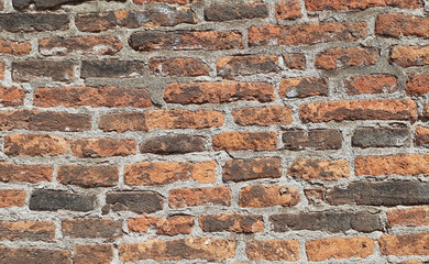 Obraz premium Old brickwork in the wall of brown and gray shades on the whole background