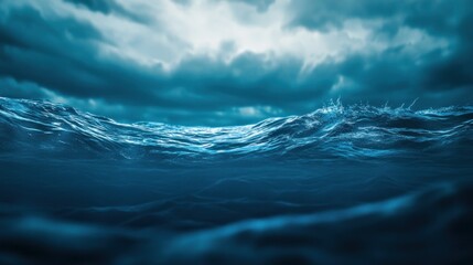 A dramatic view of rolling ocean waves under a cloudy sky, creating a moody atmosphere.