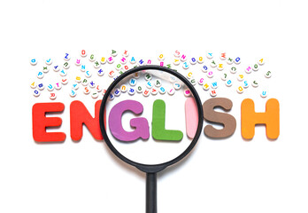 English letters scattered on white background with space for design. Language learning concept.