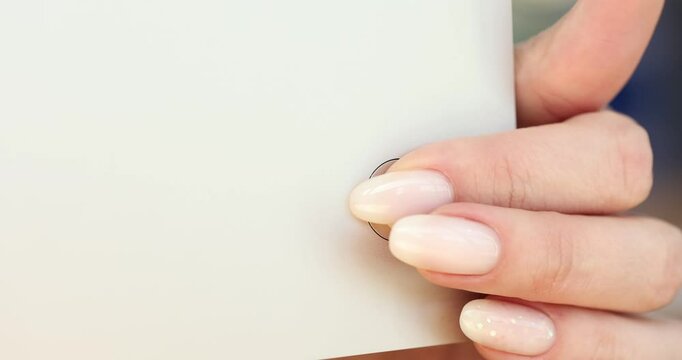 Pressing the power button on a white device