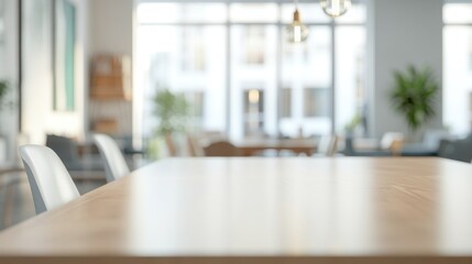 Fototapeta premium A modern workspace with a wooden table and bright, airy atmosphere.