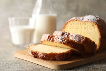 Freshly baked sponge cake on light grey table, closeup