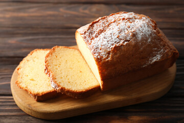 Freshly baked sponge cake on wooden table