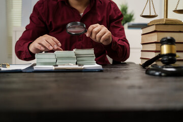 A male lawyer is working at his desk on an online judicial review, focusing on justice, fairness, and legal compliance.He reviews cases, contracts, and legal matters based on general law principles