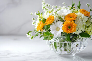 Elegant glass vase with fresh flowers on a white surface
