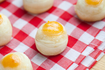 Fresh Chinese pastry moon cake with salted egg peanut place on the tablecloth.
