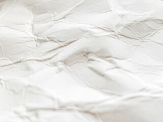 Crumpled white paper background , used as a background for text, with the back being crumpled white paper.