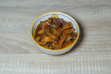 chicken meat placed in a bowl and seasoned to be used for BBQ