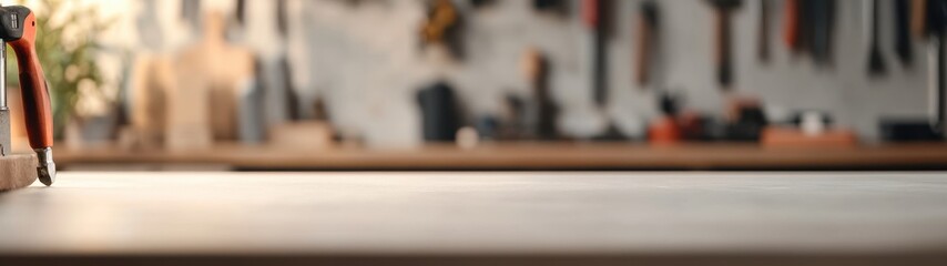 Workshop scene with an empty tabletop, tools and materials in the background, inviting creativity and productivity.