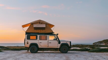 Fototapeta premium A rugged camper vehicle parked on a beach at sunset, perfect for outdoor adventure and exploration.