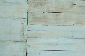 Naklejka premium The worn out plank walls painted blue look fragile