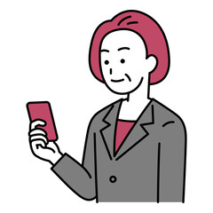 右手に持ったスマートフォンを見ている中年のスーツの女性