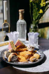 Assorted pastries and desserts on plate, ideal for bakery, culinary, and food photography themes