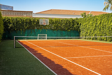 Empty tennis practice court in summer.