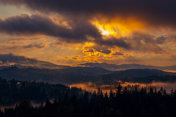 Sunrise misty morning taken in Carpathian mountains, Ukraine