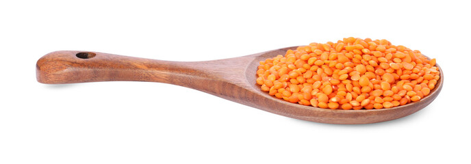 Raw lentils in spoon isolated on white