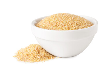 Raw wheat groats in bowl isolated on white