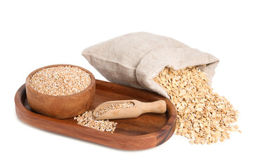 Dry wheat groats in bowl, scoop and sack with oat flakes isolated on white