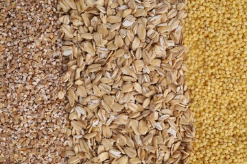 Different types of cereals as background, top view