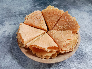 Kue semprong, Asian egg roll, sapit, sepit or kapit. Indonesian traditional wafer snack made by...