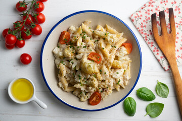 Macaroni and cheese with cauliflower. Top view table with  decoration.
