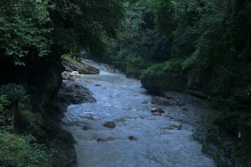 Beautiful views of the flowing river at Tapkeshwar Temple in Dehradun from different angles.