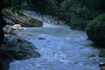 Beautiful views of the flowing river at Tapkeshwar Temple in Dehradun from different angles.