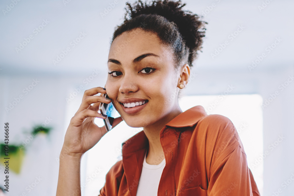 Aufkleber portrait of cheerful dark skinned hipster girl using public internet connection on modern mobile pho