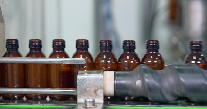 empty plastic bottles. chemical liquid sanitizer soap hand wash production line filling making process in a plastic transparent bottle third party manufacturing.