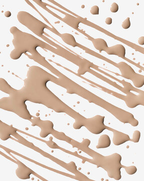 Streaks of brown makeup liquid splattered randomly across a white background.