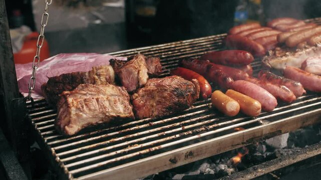 Traditional Spain Barbecue with various cuts of meat, ribs, sausages.