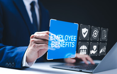 Employee Benefits and Compensation Strategy Concept. Businessman presents employee benefits options on a digital interface. Icons various benefits such as healthcare, insurance, and financial perks.